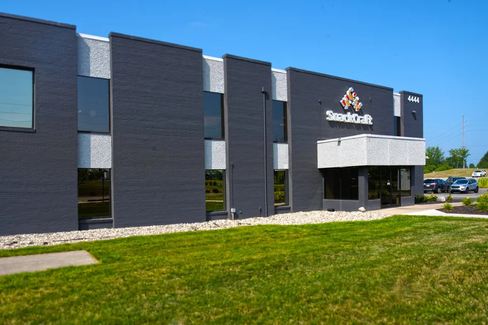 Entrance of the SnackCraft facility at 4444 52nd Street SE in Kentwood, dark gray panels with SnackCraft signage